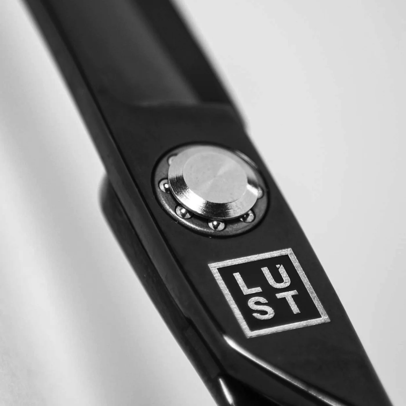 LUST black scissors logo detail