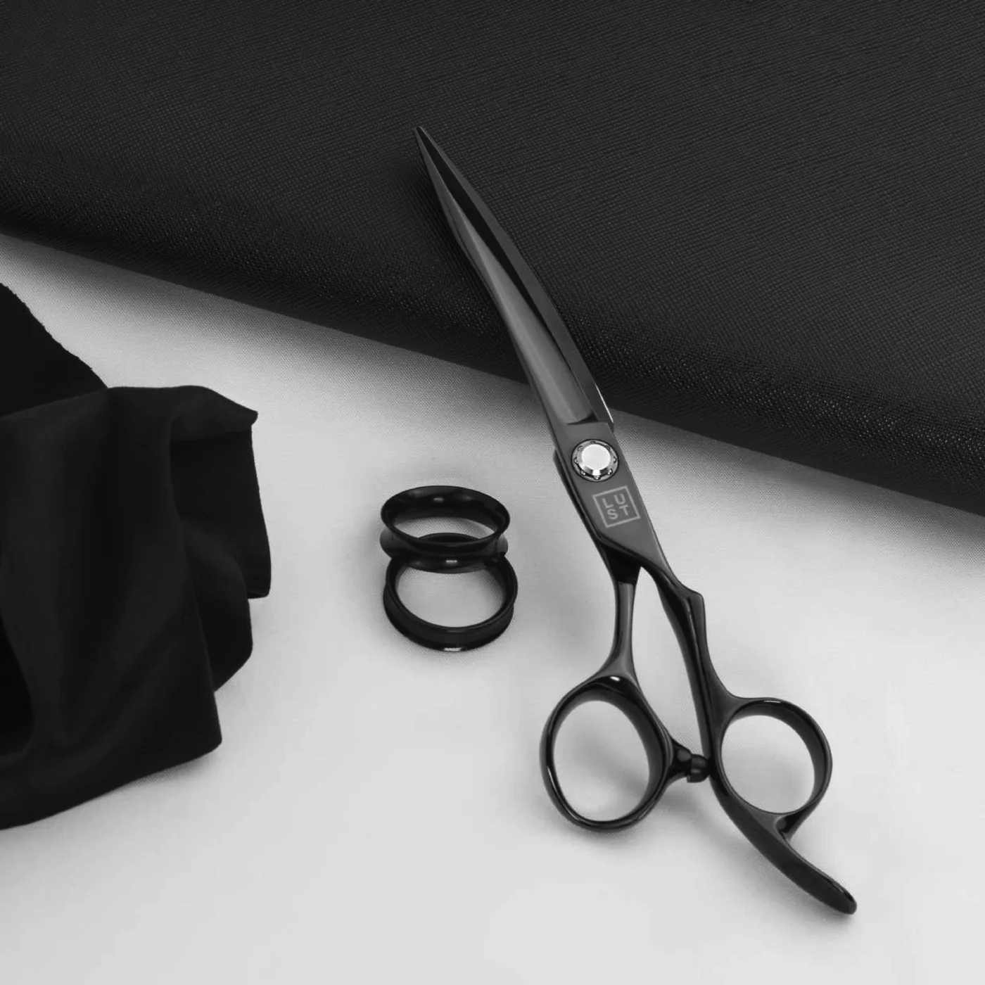 Black LUST scissors on textile
